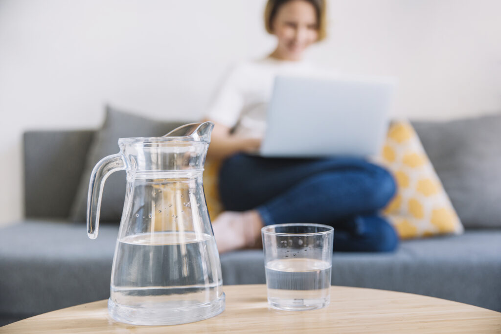 jug glass water near woman jug glass water near woman